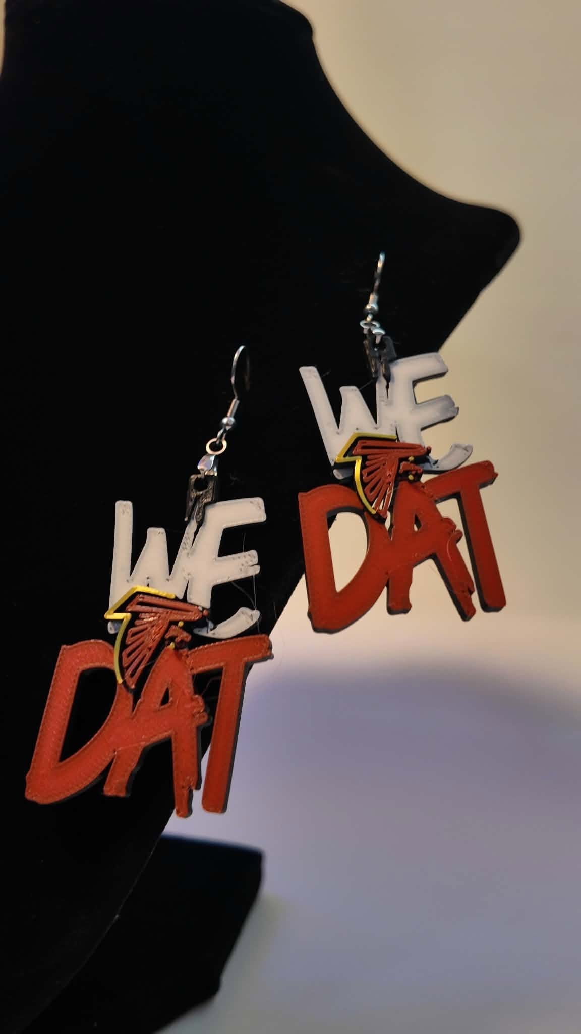 We Dat Atlanta Falcons 3D printed earrings, front view on display bust